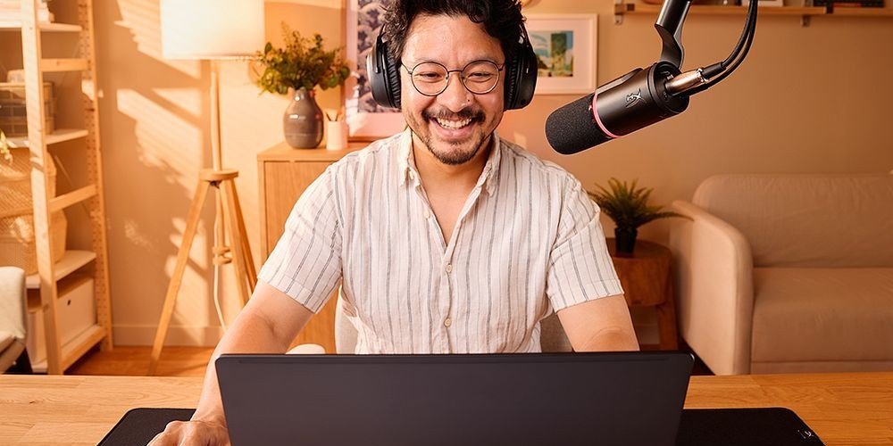 Man using HP laptop and sound equipment