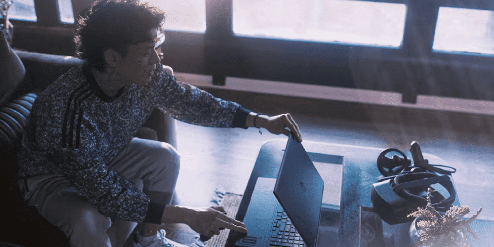 Young man using his HP laptop