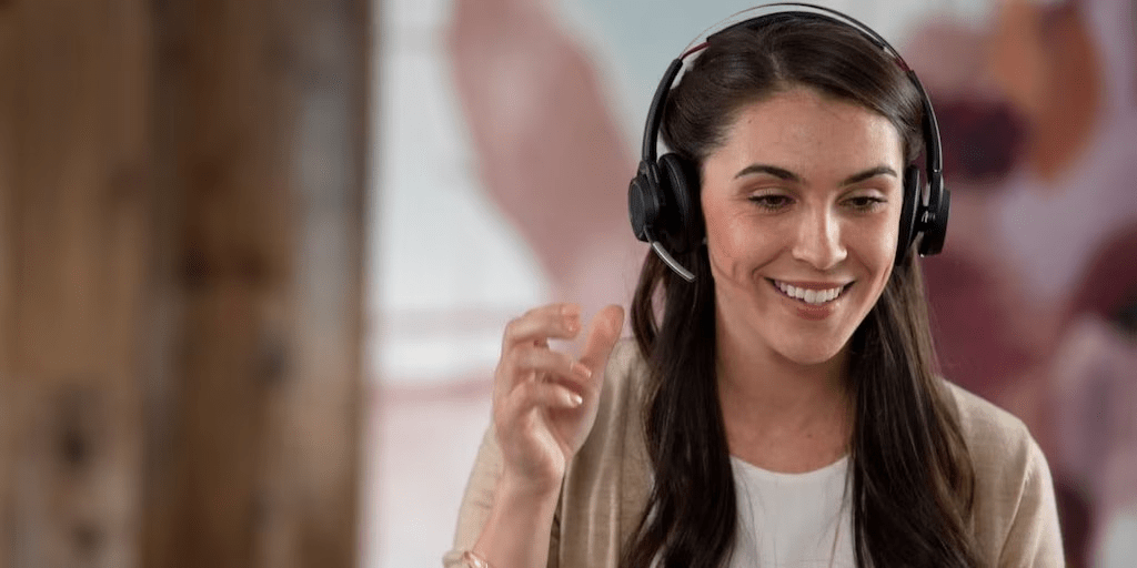 Woman wearing Poly Voyage focus headset